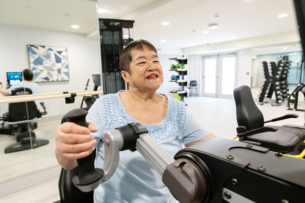 Short-Term-Page-Ammenities-section Resident using fitness equipment at Bellingham at West Chester